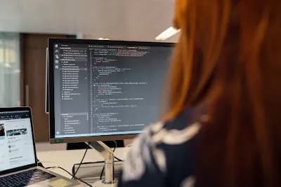 Software engineer coding on a laptop